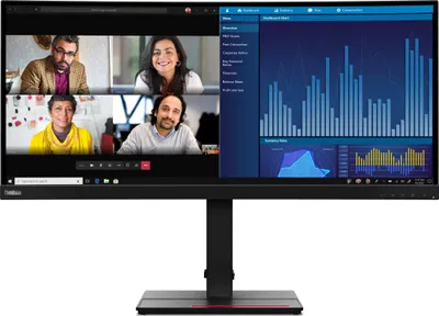 A computer monitor displaying a video conference and data charts.