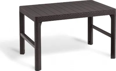 A brown rattan-style garden table on a white background.