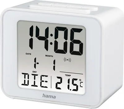 A white digital alarm clock displaying the time, date, and temperature.