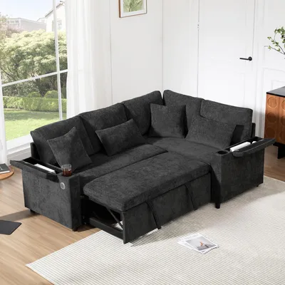 A dark gray sectional sofa with a pull-out bed and storage compartments is shown in a living room setting.