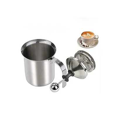 A stainless steel milk frother with a handle and a double mesh frothing attachment is shown next to a cup of coffee with latte art.