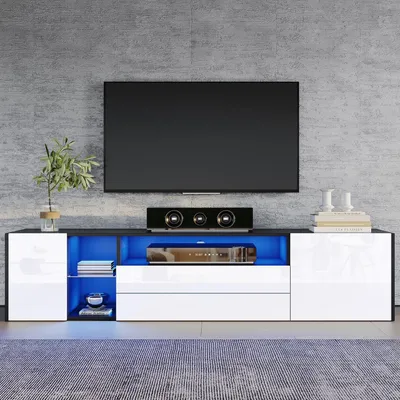 Produktbild von TV Schrank Lowboard Wohnzimmer für 75 Zoll Fernseher mit 2 Schubladen und 2 Schränken, Hochglanz LED, Weiß und Schwarz, 180x40x45cm