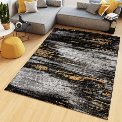 A modern living room scene with a sectional sofa, a rug, and decorative items.