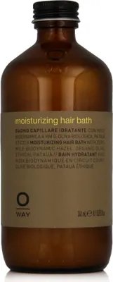 A brown glass bottle of OWAY Moisturizing Hair Bath with a kraft paper label.