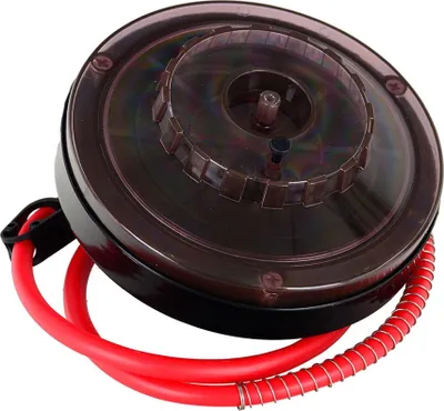 A close-up shot of a wine filter apparatus with red tubing.