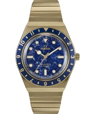 A close-up, studio shot of a gold and blue Timex watch against a white background.
