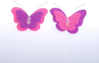 Produktbild von Filzschmetterlinge - 2-farbig - rosa-lila- 5,5 x 7 cm - 12 Stück - 75587