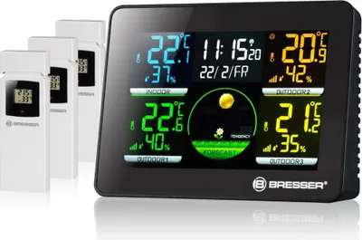A black digital weather station with multiple outdoor sensors.