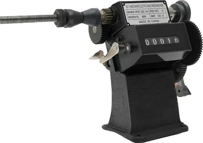 A black manual coil winding machine with a counter.