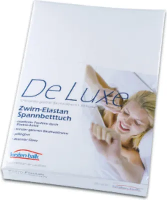 A product package for a fitted sheet with a woman in bed.
