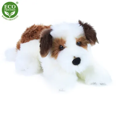 A plush dog toy lying down on a white background.