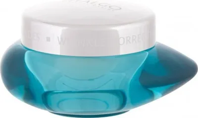 A close-up studio shot of a blue glass jar with a white lid.