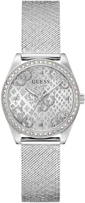 A close-up studio shot of a silver Guess watch with a mesh band and a crystal-embellished face.