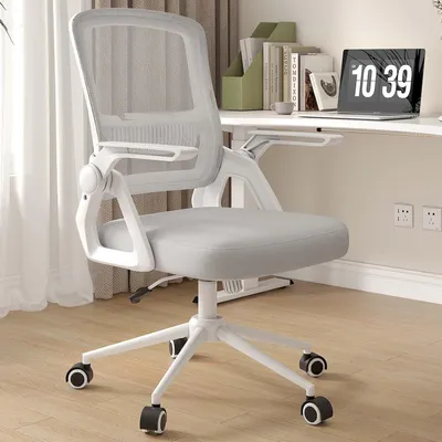 A gray mesh office chair with white accents is shown in a home office setting.