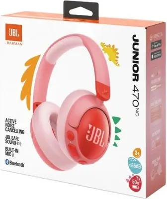 The image shows the retail packaging of JBL Junior 470NC wireless headphones for children. The packaging features a pink and red design with illustrations of dinosaurs and the JBL logo.