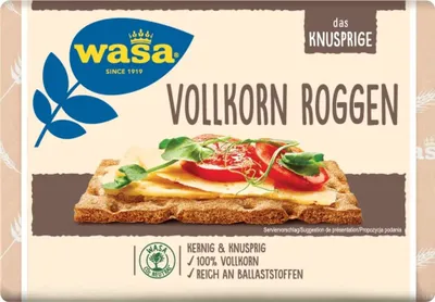 The image shows the packaging of Wasa Vollkorn Roggen crispbread, with a close-up of a prepared crispbread with toppings.