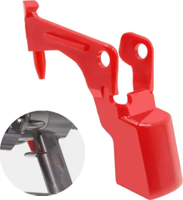 A red plastic accessory for a vacuum cleaner.