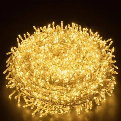 A coiled string of warm white LED lights against a dark background.