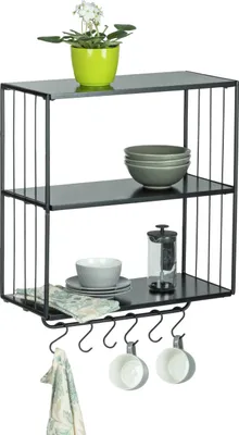 A three-tiered wall shelf with a plant, bowls, and mugs.