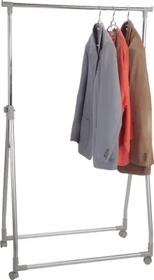 A clothing rack with three jackets hanging on it, against a white background.