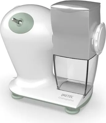 A white electric cheese grater with a clear plastic container sits on a white surface.