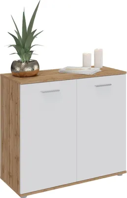 A modern sideboard with two doors and a wooden top, decorated with a plant and candles.