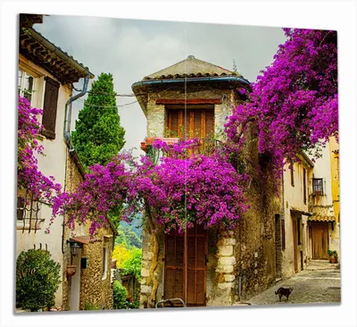 Produktbild von Wallario Herdabdeckplatte aus Glas, Größe 60 x 52 cm 2-teilig, Motiv Malerische Stadt in der Provence mit bunten Blumen
