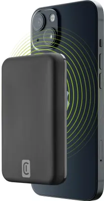 A black MagSafe wireless power bank is attached to the back of a black smartphone, with green concentric circles indicating wireless charging.