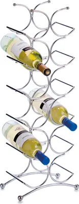A chrome-plated metal wine rack holding three bottles of white wine.