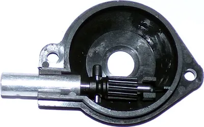 A cutaway view of an oil pump assembly, showing internal gears and a shaft, against a white background.