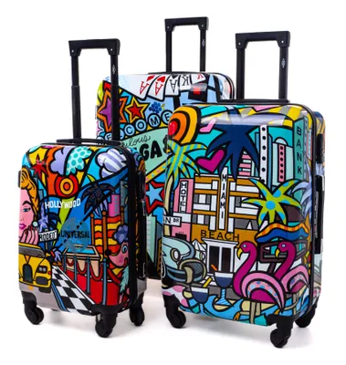 Three colorful suitcases with pop art style designs.