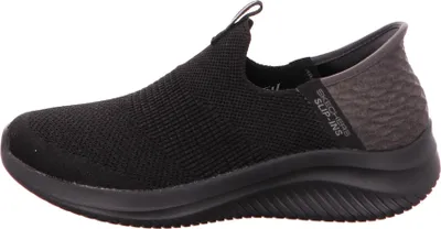 A side view of a black Skechers slip-on sneaker.