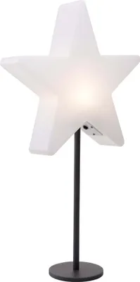 A white star-shaped lamp on a black stand against a white background.