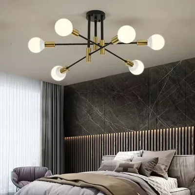 A modern bedroom with a chandelier.