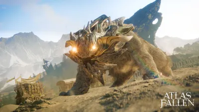 A large, armored creature with glowing eyes walks through a desert landscape with mountains in the background.