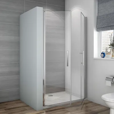 A modern bathroom with a glass shower enclosure.