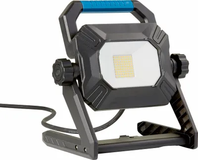 A portable LED work light with a stand and a blue handle.