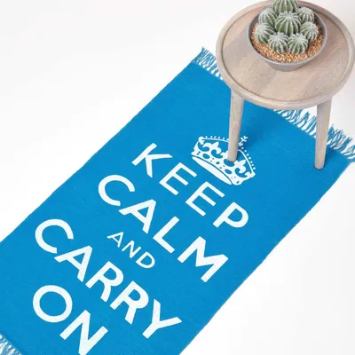 Produktbild von HOMESCAPES Baumwollteppich Keep Calm and Carry On – blau-weiß, 60x100 cm