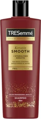 A maroon bottle of TRESemmé Keratin Smooth shampoo against a white background.