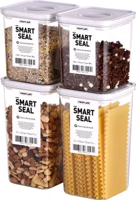 Four clear plastic food storage containers with white lids, filled with different food items, arranged in a two-by-two grid.