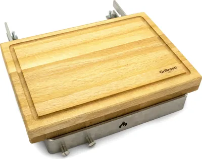 A wooden cutting board with a metal frame, mounted on a white background.