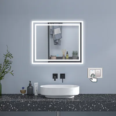 A modern bathroom vanity with a sink, faucet, and a lighted mirror.
