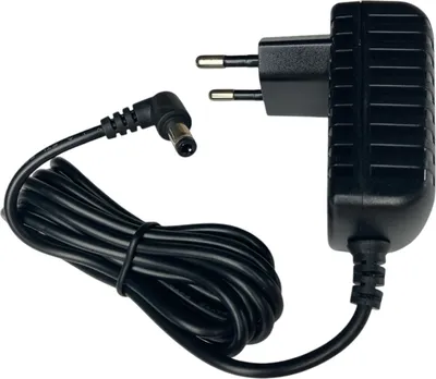 A black power adapter with a coiled cable and a European plug.