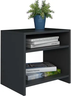A black wooden nightstand with books and a plant on it.