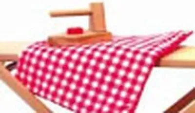 A wooden toy iron sits on a red and white checkered cloth draped over a wooden ironing board.