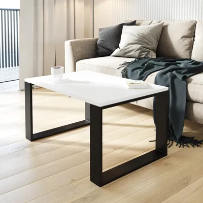 A modern living room scene with a couch and coffee table.
