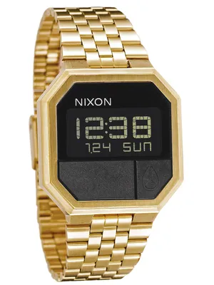 A close-up studio shot of a gold digital watch.