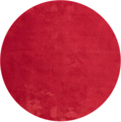A circular red rug is shown from a top-down perspective against a white background.