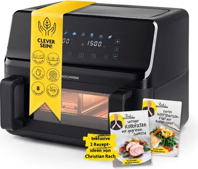 A black air fryer with promotional materials attached and placed next to it.
