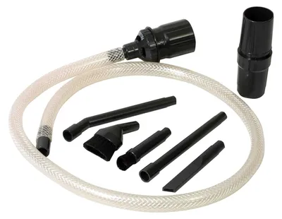 A set of vacuum cleaner attachments and a hose are laid out on a white background.